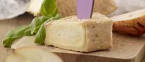 Block of Milleens Cheese with Knife