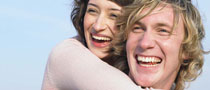 Couple laughing and hugging