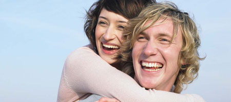 Couple laughing and hugging