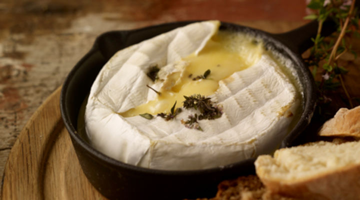 Baked cheese with cranberries and walnuts