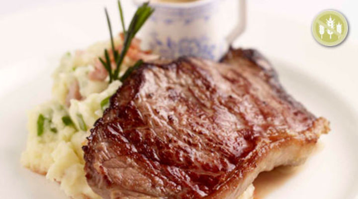 Striploin Steaks on Smoked Bacon Champ